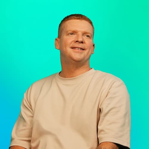 Sam, a man smiling
